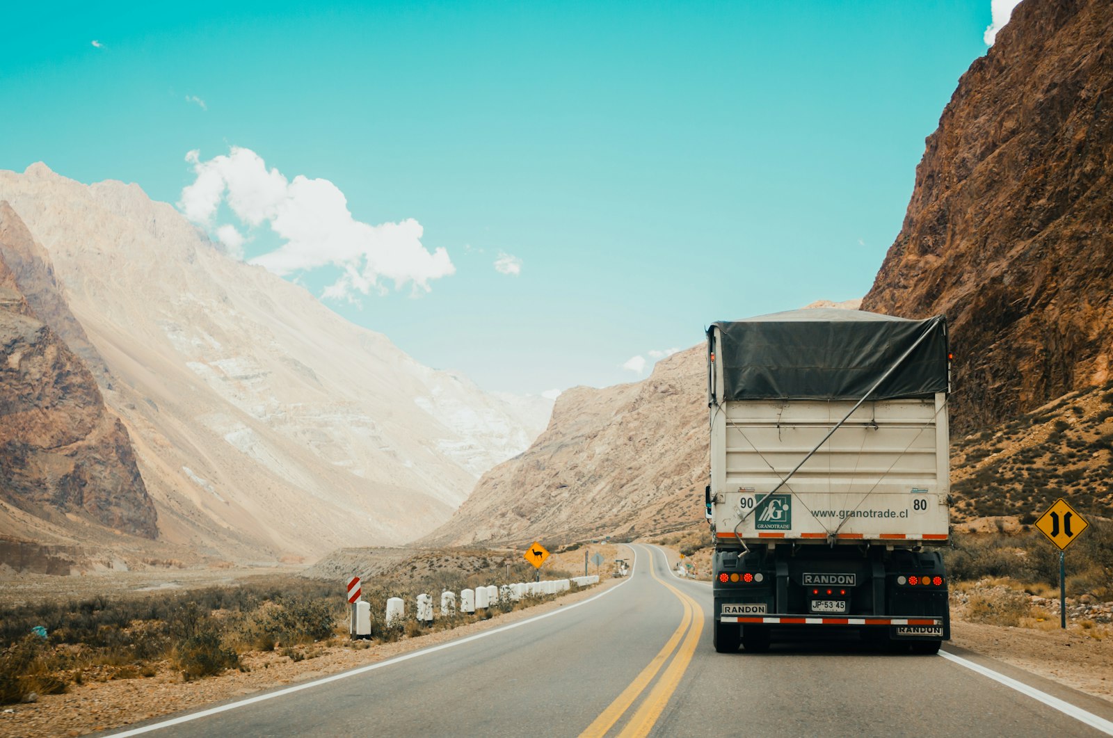Commercial truck traveling on a mountain highway